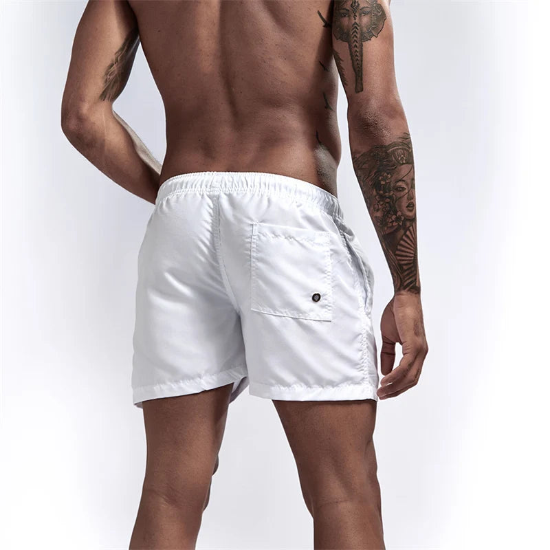 Maillot de bain pour hommes avec doublure en maille poches latérales short de plage solide séchage rapide léger cordon de serrage short de bain maillot de bain d'été