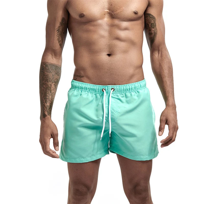 Maillot de bain pour hommes avec doublure en maille poches latérales short de plage solide séchage rapide léger cordon de serrage short de bain maillot de bain d'été
