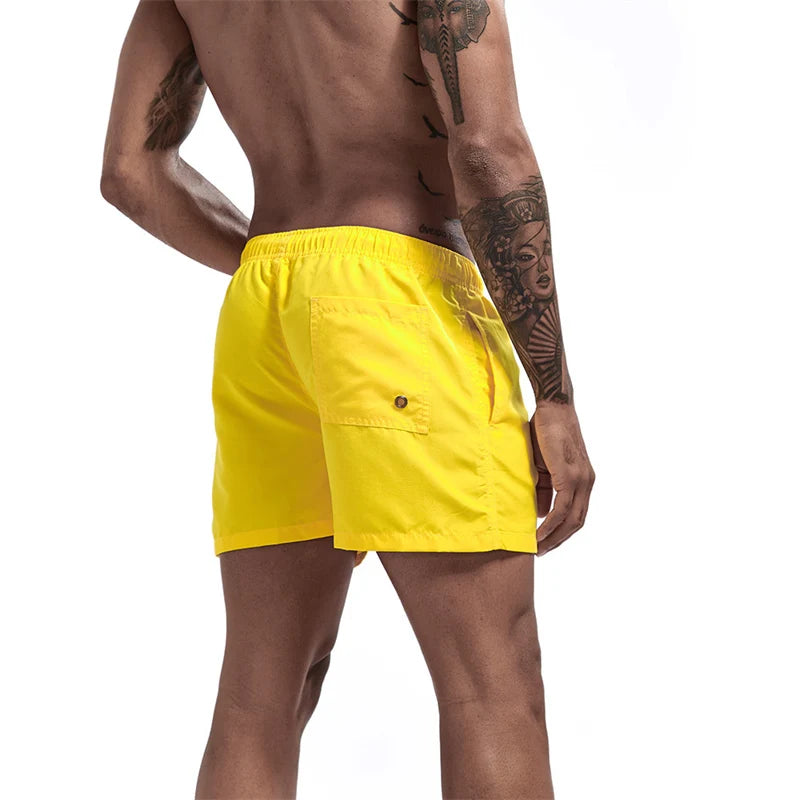 Maillot de bain pour hommes avec doublure en maille poches latérales short de plage solide séchage rapide léger cordon de serrage short de bain maillot de bain d'été