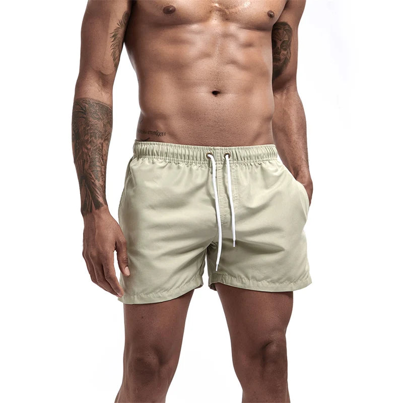 Maillot de bain pour hommes avec doublure en maille poches latérales short de plage solide séchage rapide léger cordon de serrage short de bain maillot de bain d'été