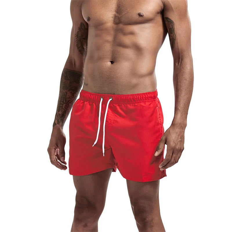 Maillot de bain pour hommes avec doublure en maille poches latérales short de plage solide séchage rapide léger cordon de serrage short de bain maillot de bain d'été