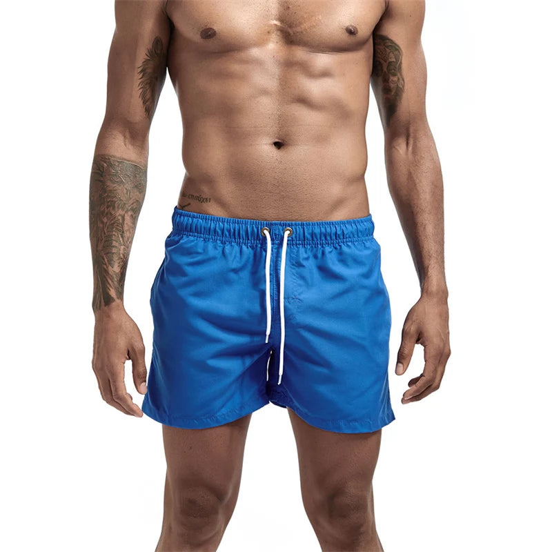 Maillot de bain pour hommes avec doublure en maille poches latérales short de plage solide séchage rapide léger cordon de serrage short de bain maillot de bain d'été