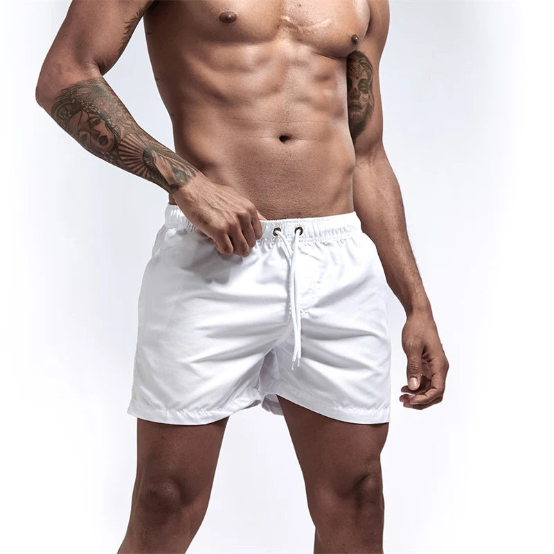 Maillot de bain pour hommes avec doublure en maille poches latérales short de plage solide séchage rapide léger cordon de serrage short de bain maillot de bain d'été
