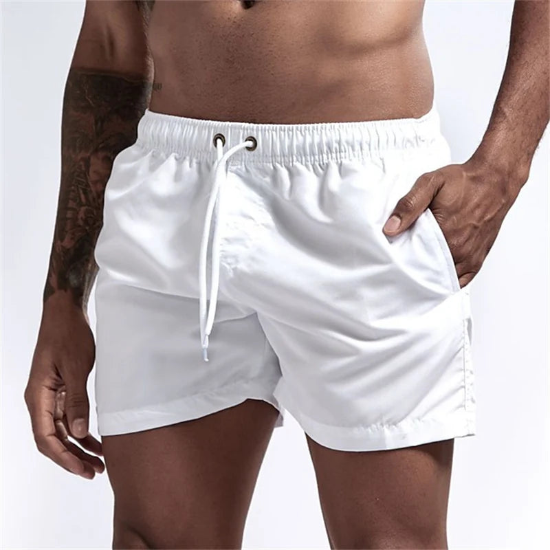 Maillot de bain pour hommes avec doublure en maille poches latérales short de plage solide séchage rapide léger cordon de serrage short de bain maillot de bain d'été