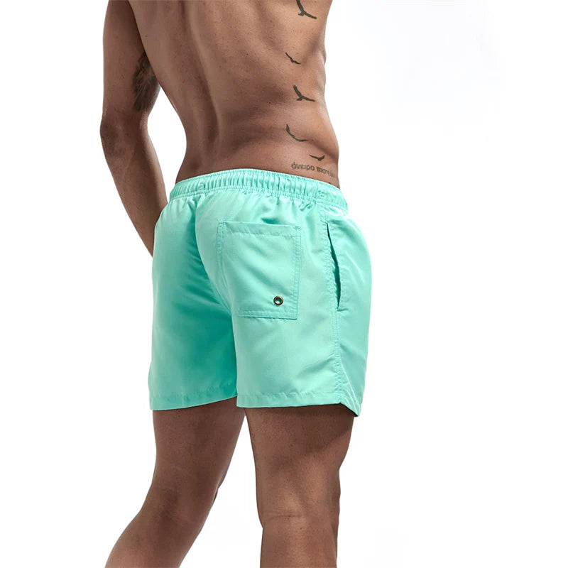 Maillot de bain pour hommes avec doublure en maille poches latérales short de plage solide séchage rapide léger cordon de serrage short de bain maillot de bain d'été