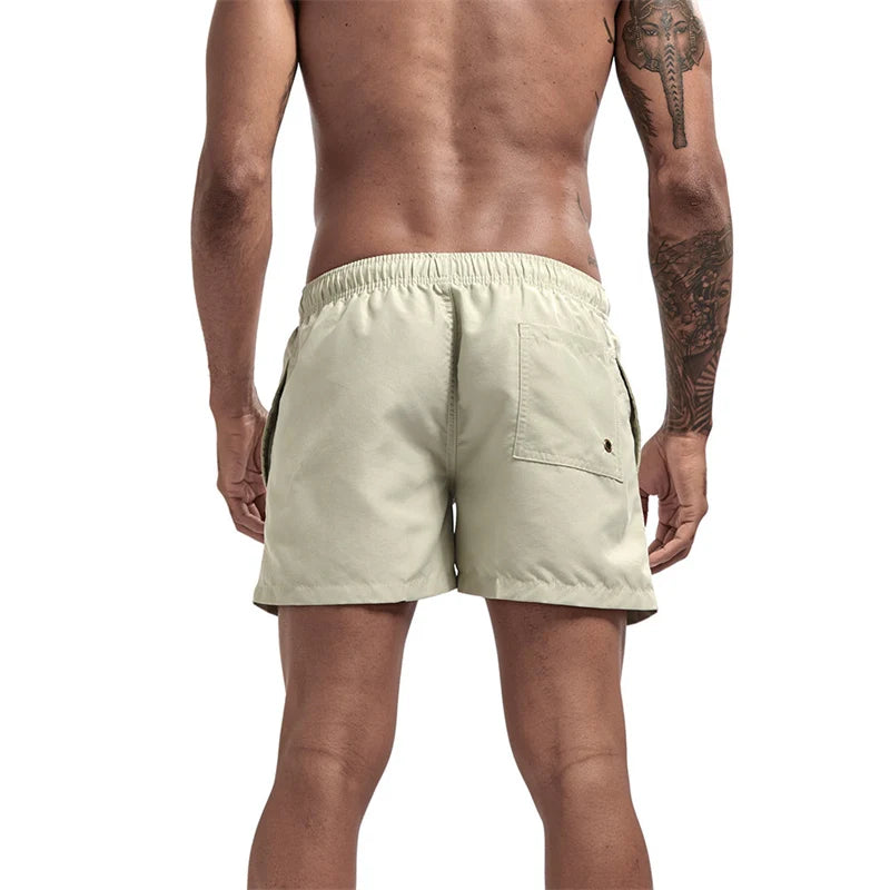 Maillot de bain pour hommes avec doublure en maille poches latérales short de plage solide séchage rapide léger cordon de serrage short de bain maillot de bain d'été