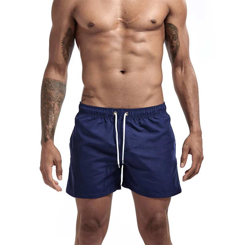 Maillot de bain pour hommes avec doublure en maille poches latérales short de plage solide séchage rapide léger cordon de serrage short de bain maillot de bain d'été