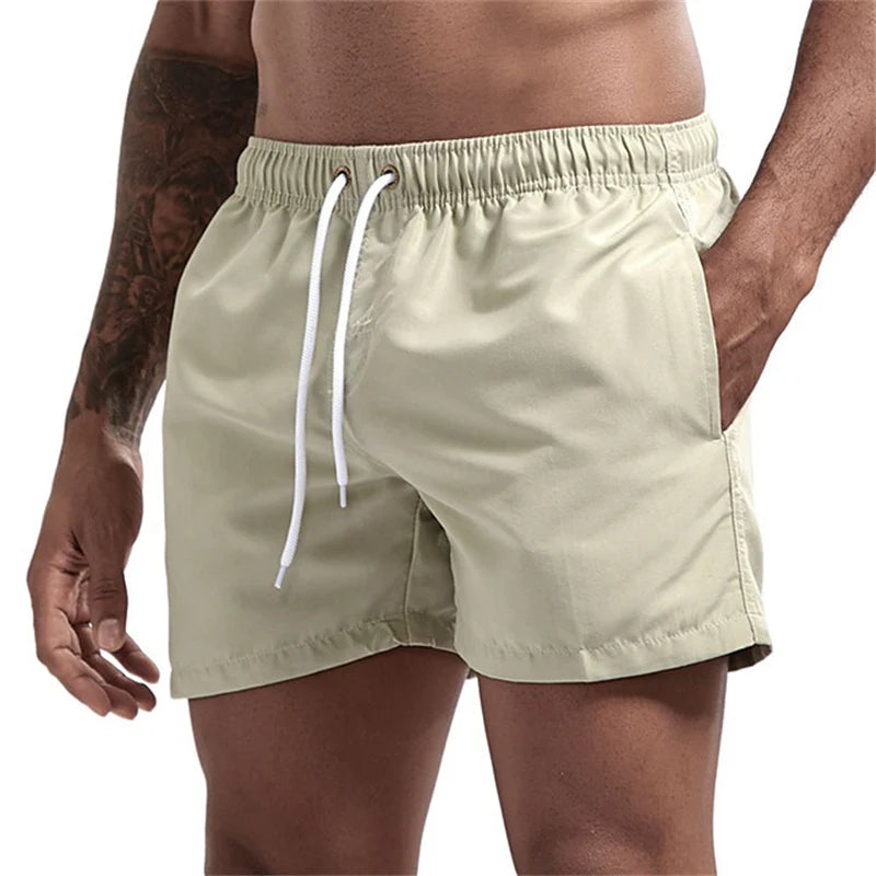 Maillot de bain pour hommes avec doublure en maille poches latérales short de plage solide séchage rapide léger cordon de serrage short de bain maillot de bain d'été