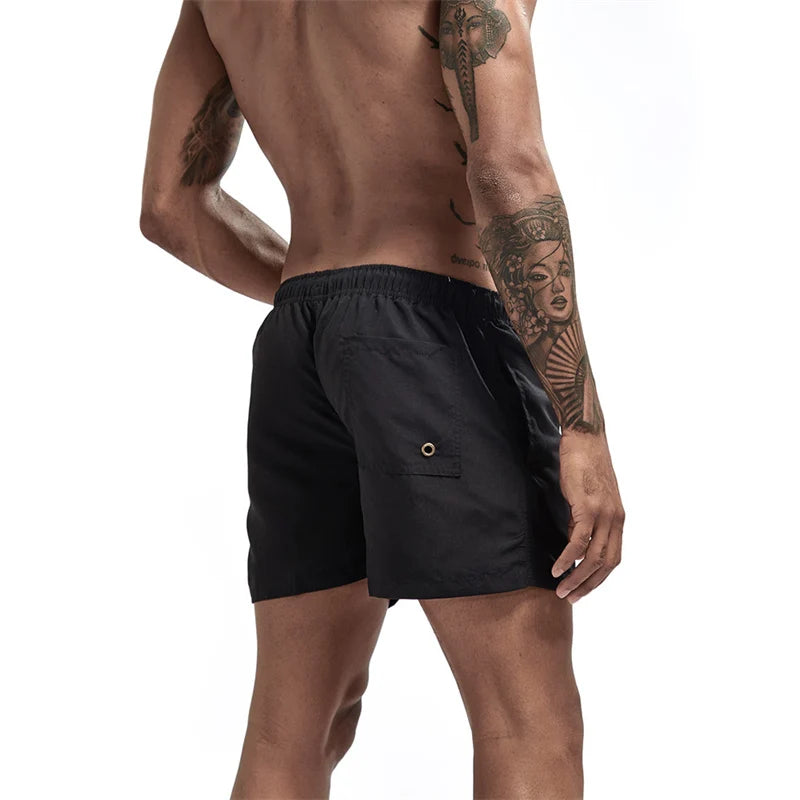 Maillot de bain pour hommes avec doublure en maille poches latérales short de plage solide séchage rapide léger cordon de serrage short de bain maillot de bain d'été