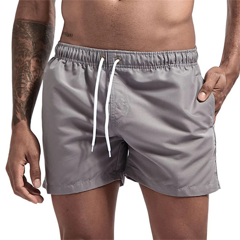 Maillot de bain pour hommes avec doublure en maille poches latérales short de plage solide séchage rapide léger cordon de serrage short de bain maillot de bain d'été