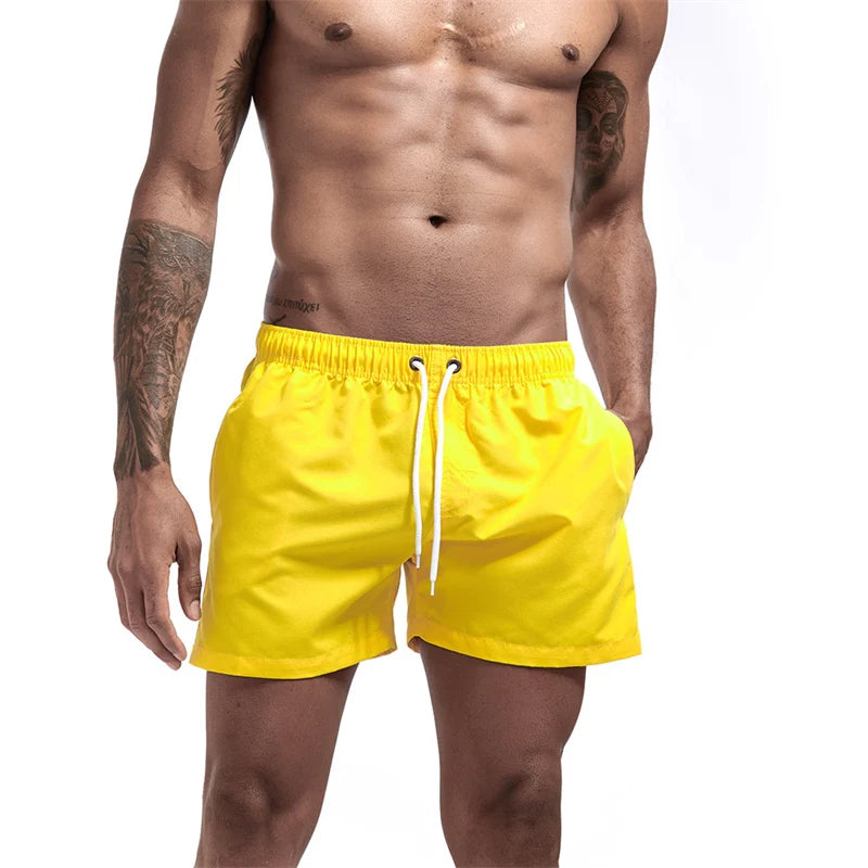 Maillot de bain pour hommes avec doublure en maille poches latérales short de plage solide séchage rapide léger cordon de serrage short de bain maillot de bain d'été