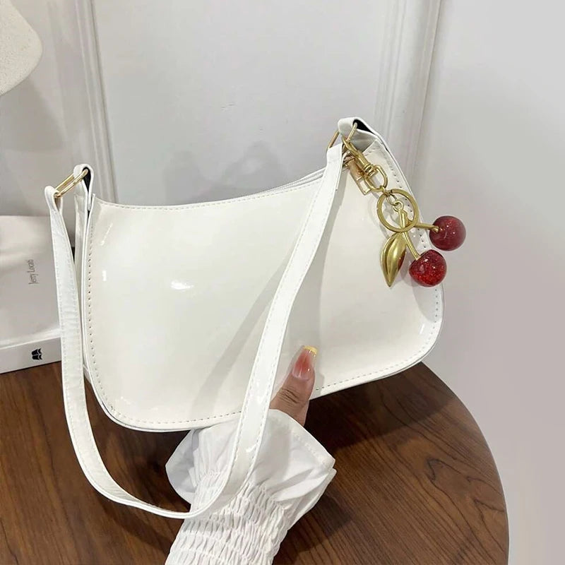 Bolso de cuero PU para mujer, versátil, a la moda, color sólido, colgante de cereza, bolso de hombro informal, bolso de mano, bolso de axila para niñas