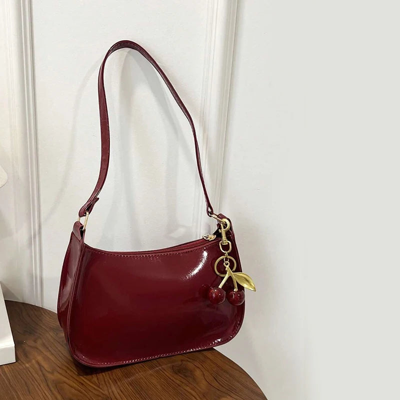 Bolso de cuero PU para mujer, versátil, a la moda, color sólido, colgante de cereza, bolso de hombro informal, bolso de mano, bolso de axila para niñas