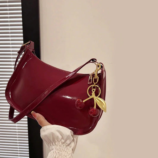 Bolso de cuero PU para mujer, versátil, a la moda, color sólido, colgante de cereza, bolso de hombro informal, bolso de mano, bolso de axila para niñas