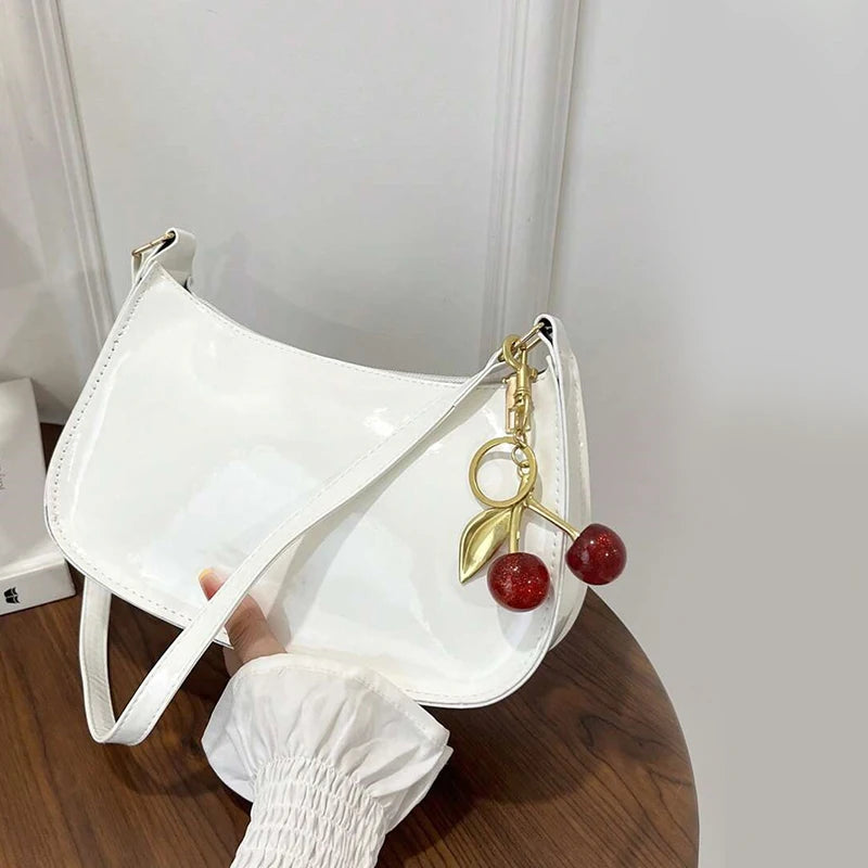 Bolso de cuero PU para mujer, versátil, a la moda, color sólido, colgante de cereza, bolso de hombro informal, bolso de mano, bolso de axila para niñas